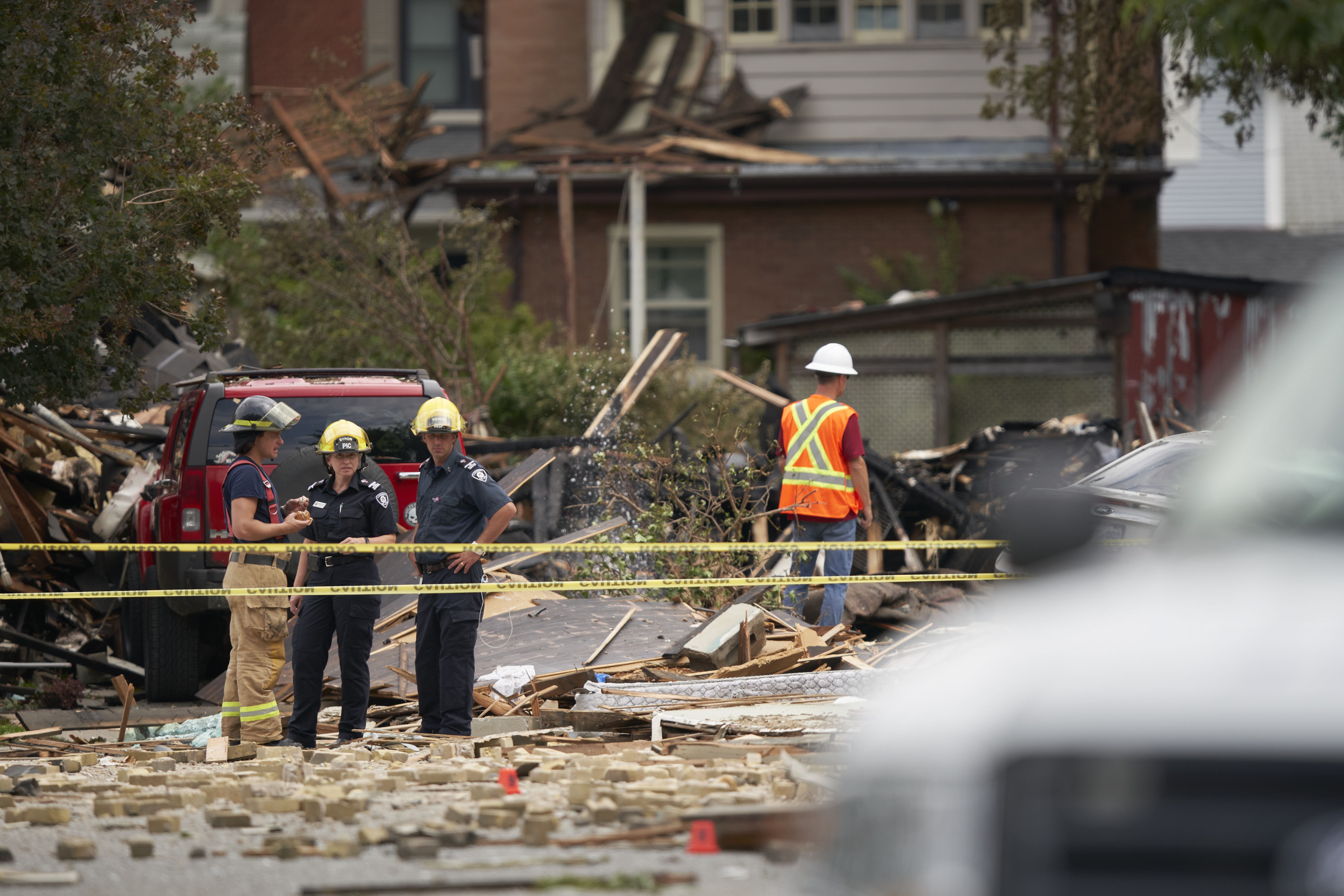 London fire officials at the scene of the Woodman Avenue explosion, Aug. 15, 2019. At left are firefighter Charlie Moir, public information coordinator Shannon Byron, and investigator Chris Rennie.