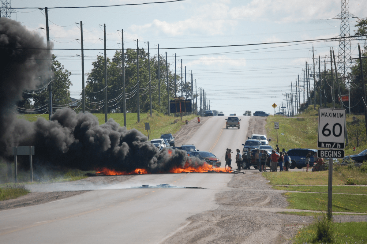 OPP closed off roads for several hours as a group of protesters lit tires on Highway 6 near Argyle Street in Caledonia, Ont on Aug. 5, 2020.