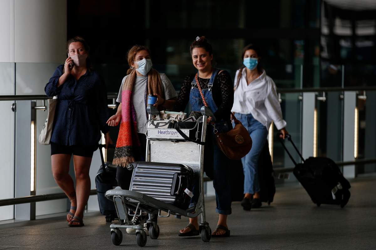 Travellers exit Heathrow Airport Terminal 2 on August 22, 2020 in London, England. In changes to the UK’s travel corridor rules, as of August 29 at 4 a.m., travellers arriving from Czech Republic, Jamaica and Switzerland are required to quarantine themselves for 14 days. From the same date, travellers from Cuba are no longer required to quarantine. (Photo by Hollie Adams/Getty Images)