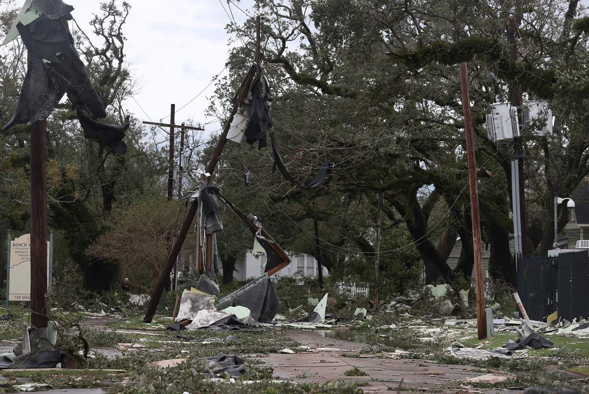 A street is seen strewn with debris and downed power lines after hurricane Laura passed through the area on Aug. 27, 2020 in Lake Charles, La.