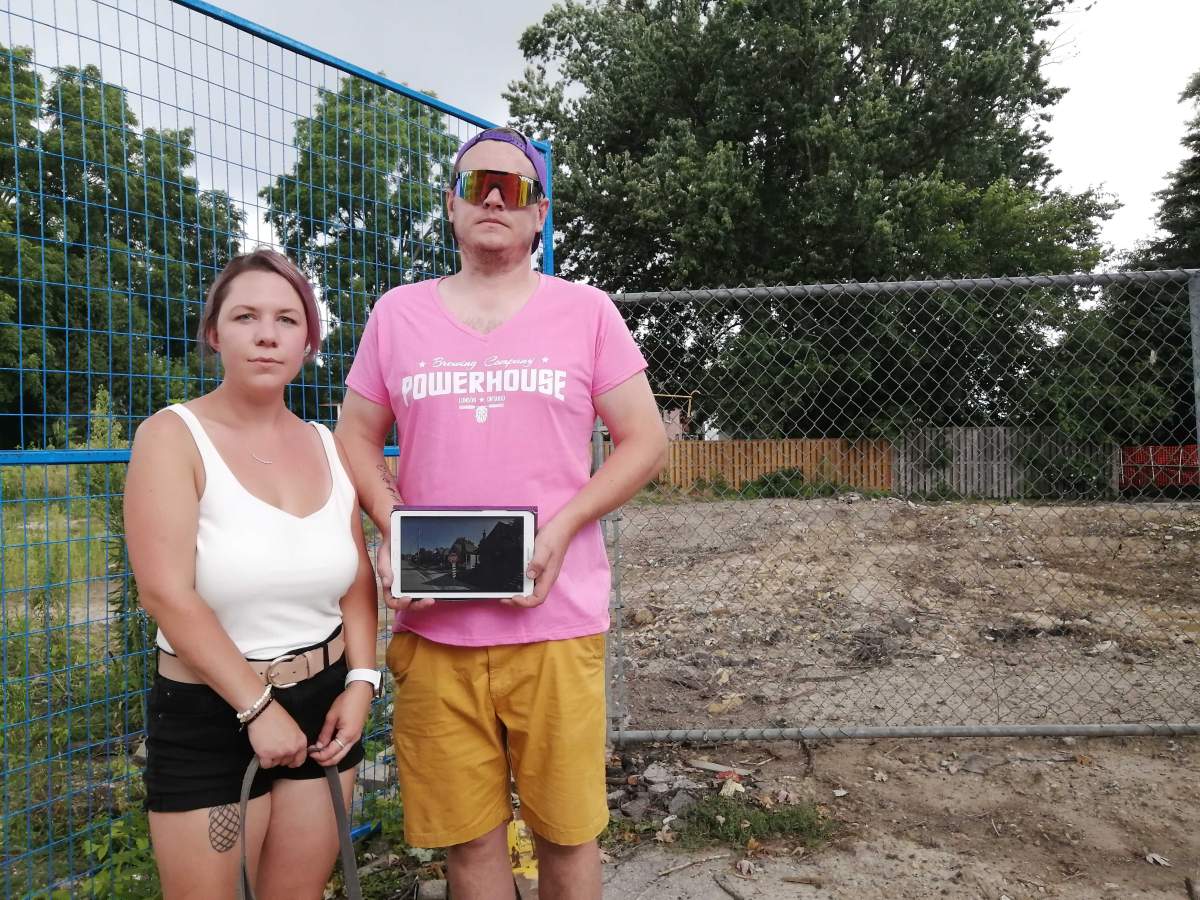 Chris Patterson with his partner Laura at the site of their demolished house that was destroyed after a gas explosion one year ago. OEV, Old East Village, Chris Patterson