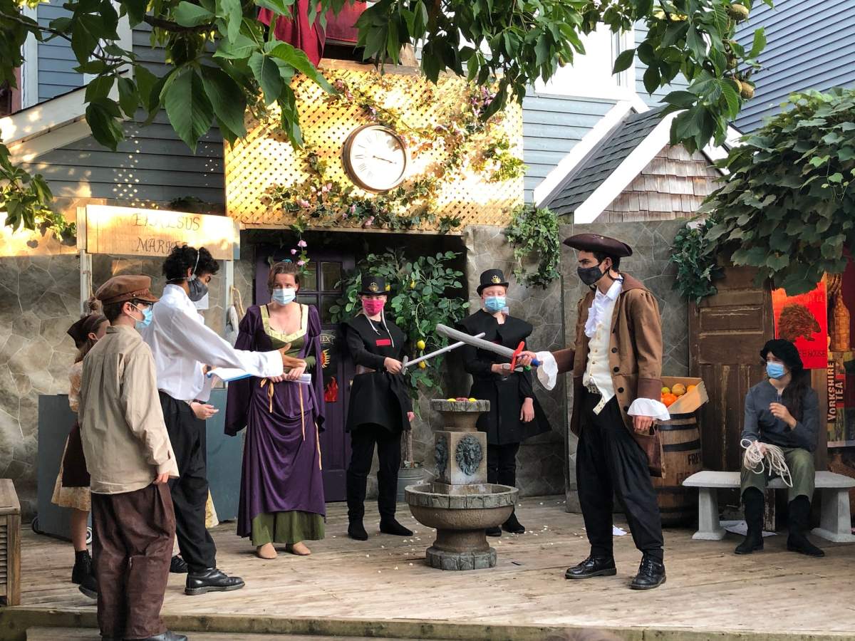 The cast of the Company of Adventurers production of Comedy of Errors rehearses in an Old Ottawa South backyard.