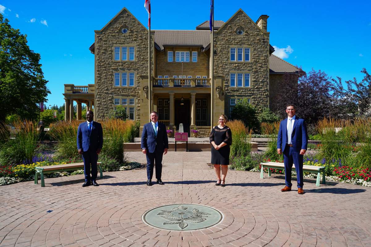Left to right: Justice Minister and Solicitor General Kaycee Madu, Alberta Premier Jason Kenney, Municipal Affairs Minister Tracy Allard and Minister of Jobs, Economy and Innovation Doug Schweitzer outside Government House in Edmonton, Alta. on Tuesday, Aug. 25, 2020 after a cabinet shuffle.
