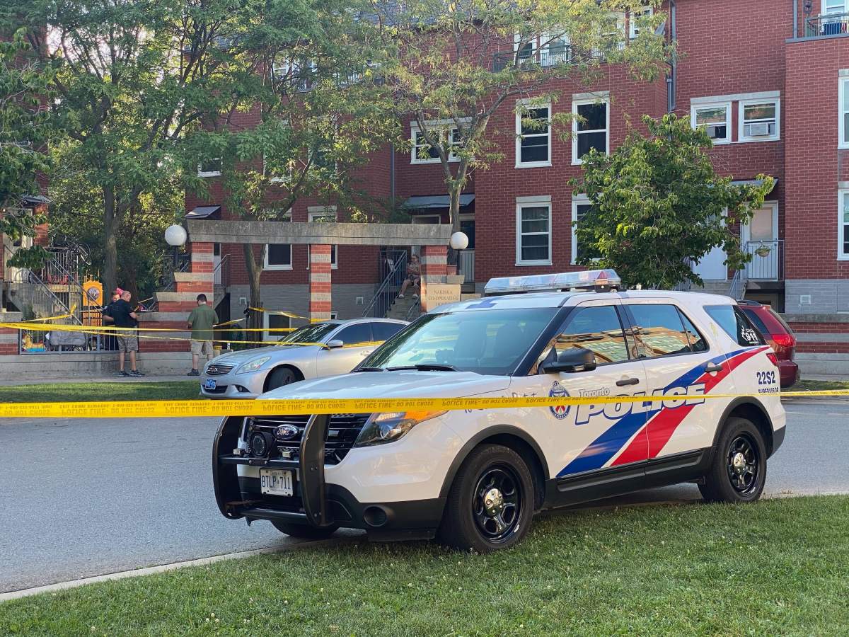 Toronto police at the scene of a stabbing at Lakeshore Boulevard West and Thirteenth Street on Saturday.