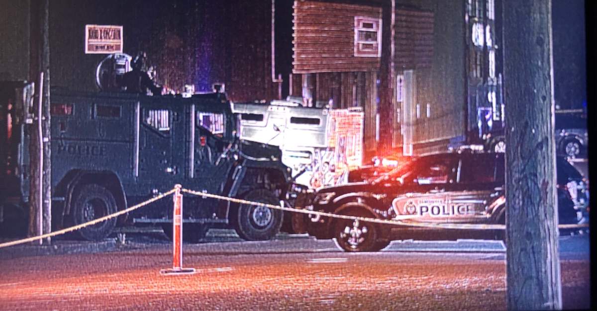 An armoured police vehicle can be seen at the scene of a police standoff in East Vancouver that closed off a section of Venables Street for hours Wednesday night.