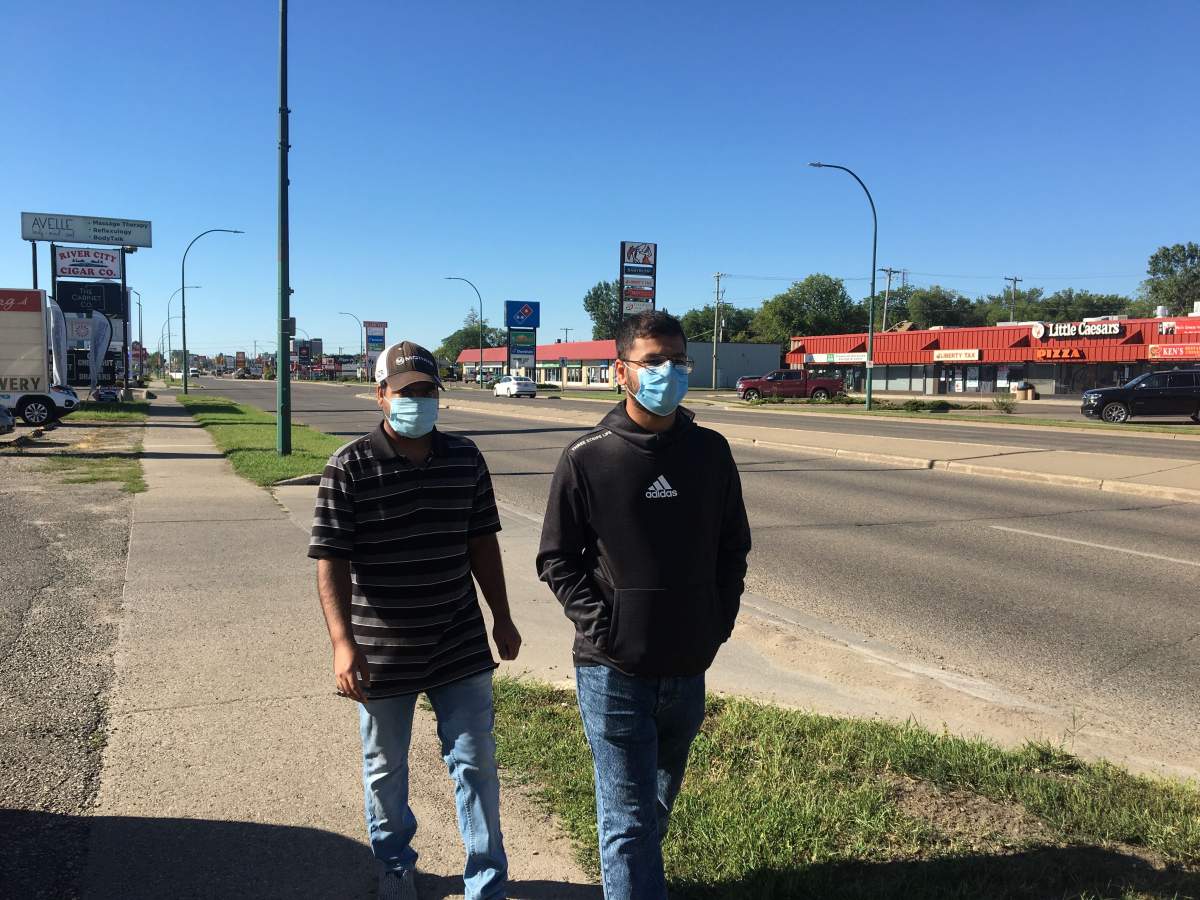 Brandon residents wear masks Monday morning.