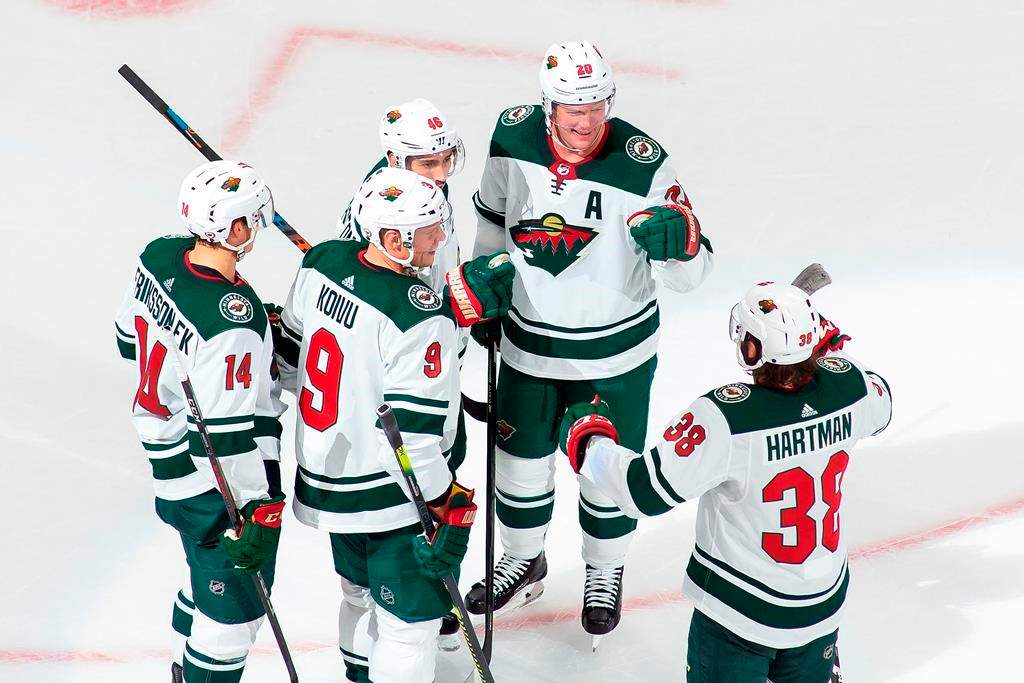 Minnesota Wild’s Joel Eriksson Ek (14), Mikko Koivu (9), Jared Spurgeon (46), Ryan Suter (20) and Ryan Hartman (38) celebrate a goal during third-period NHL Stanley Cup qualifying-round action against the Vancouver Canucks in Edmonton, Sunday, Aug. 2, 2020. THE CANADIAN PRESS/Codie McLachlan