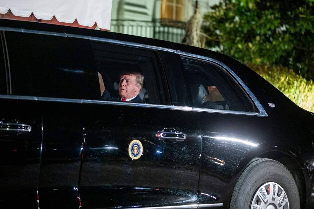 U.S. President Donald Trump sits in the presidential limo as he departs the White House for Capitol Hill, where he will deliver his second State of the Union speech, on Feb. 5, 2019.