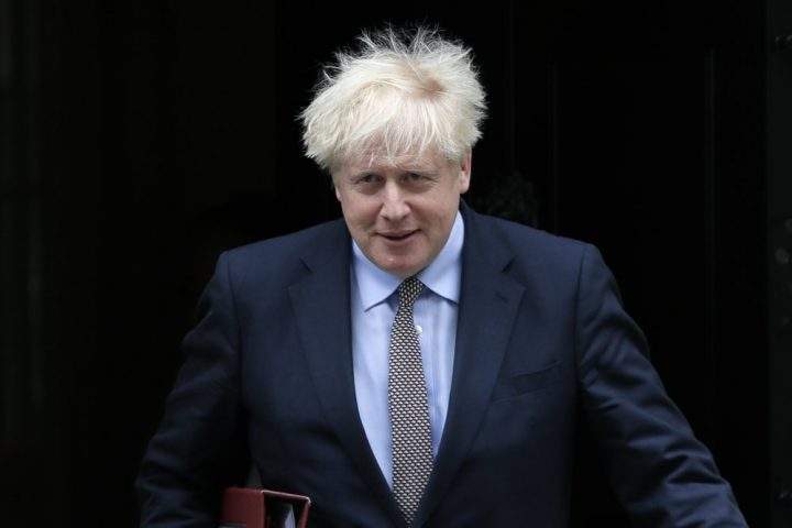 FILE - In this Wednesday, Sept. 9, 2020 file photo, Britain's Prime Minister Boris Johnson leaves Downing Street to attend the weekly session of Prime Ministers Questions in Parliament in London. British Prime Minister Boris Johnson has strongly defended his controversial plan to override sections of the Brexit deal that he negotiated with the European Union, arguing that the bloc has an “extreme” interpretation of the treaty that could jeopardize the future of the U.K. In a column Saturday, Sept. 12, 2020 in The Daily Telegraph, Johnson said the Internal Market Bill is required to end EU threats to impose a “blockade” in the Irish Sea that he argues could “carve up our country.”.