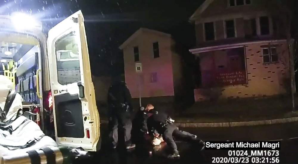 In this image taken from police body camera video provided by Roth and Roth LLP, Rochester police officers hold down Daniel Prude on March 23, 2020, in Rochester, N.Y.