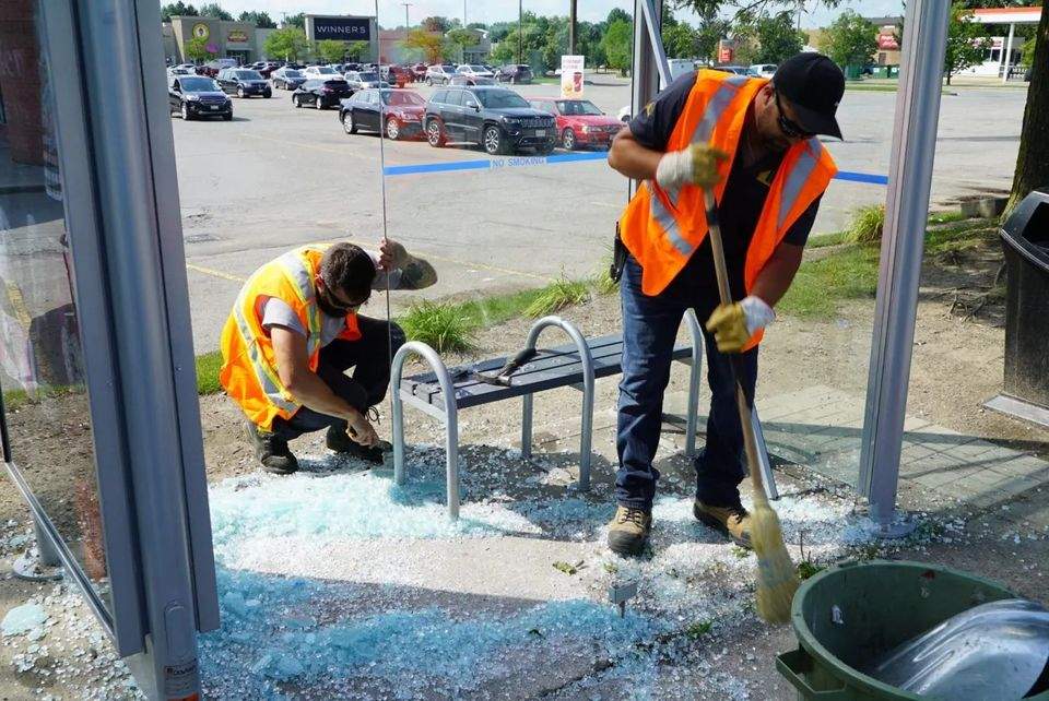 Vandalized bus shelter in London. 