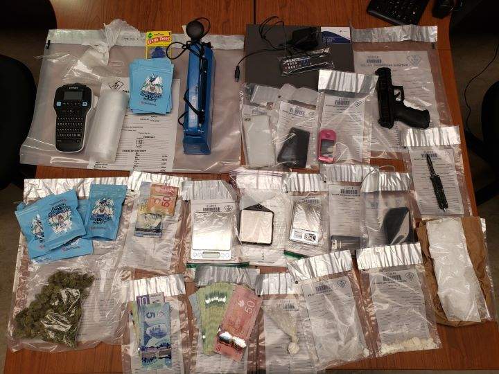 On Friday, officers say they executed a search warrant at a residence on Trailview Lane and charged two people.
