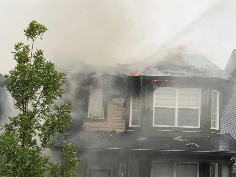 Calgary firefighters battle a house fire in the 400 block of Evanston Drive Northwest on Tuesday, Sept. 8, 2020.