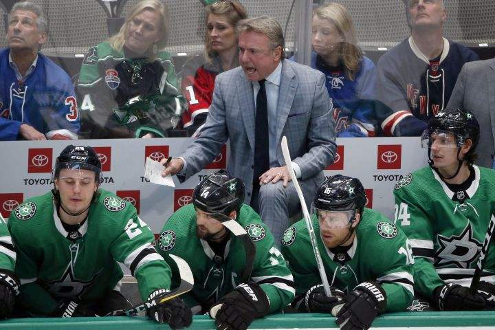 In this March 10, 2020, file photo, Dallas Stars interim head coach Rick Bowness yells from the bench as they played the New York Rangers during the third period of an NHL hockey game in Dallas. 