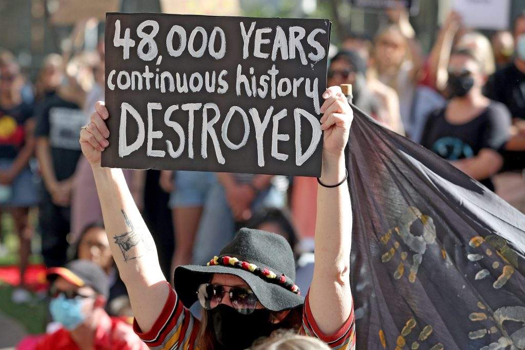 Protesters are seen during a rally outside the Rio Tinto office in Perth, Australia, 09 June 2020. Rio Tinto recently detonated explosives in an area of the Juukan Gorge in the Pilbara, destroying two ancient deep-time rock shelters, much to the distress of the Puutu Kunti Kurrama and Pinikura people.  