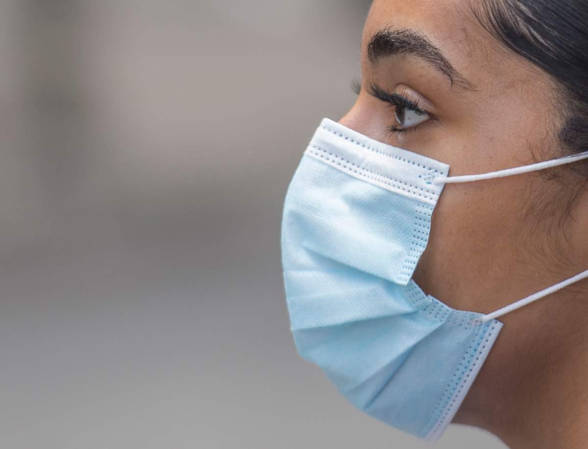 A person wears a face mask on a street in Montreal, Saturday, Aug. 22, 2020. 