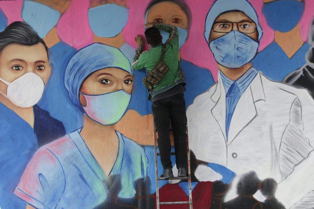 A urban artist makes a mural in memory of all health workers who lost their lives in the midst of the COVID-19 pandemic on August 25, 2020 in Mexico City, Mexico. Because the authorities have not provided the necessary medical supplies, doctors face a high risk of contagion by coronavirus. 