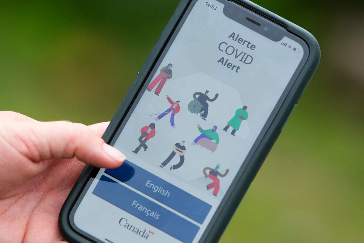 A person uses the COVID Alert app pictured on a cellphone in Kingston, Ontario on Thursday, Aug 27, 2020.