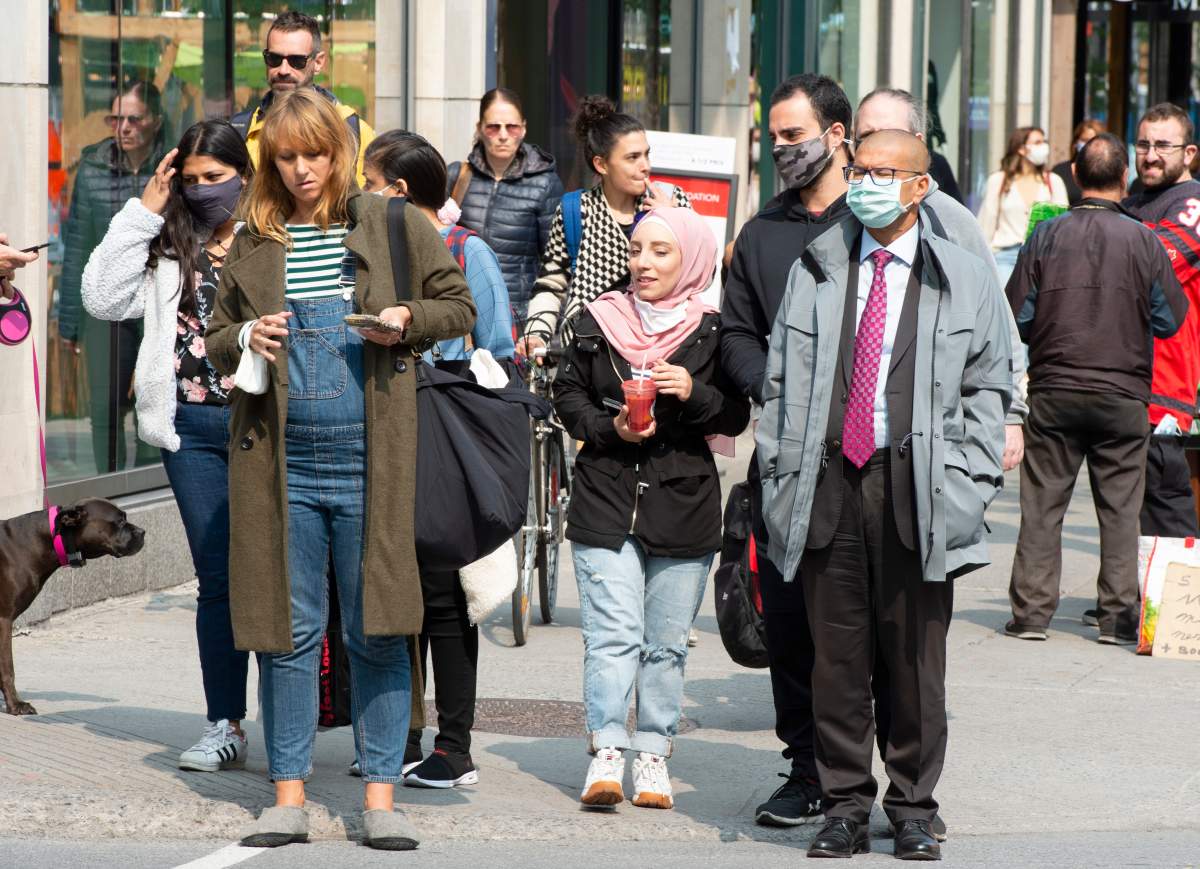 Pedestrians make their way along Ste- Catherine street in Montreal, Tuesday, Sept. 15, 2020.