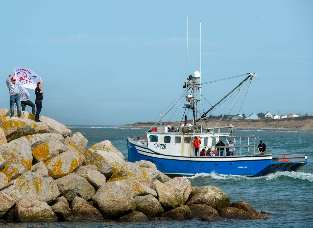 Members of the Sipekne'katik First Nation head from the wharf in Saulnierville, N.S., after launching its own self-regulated fishery on Thursday, Sept. 17, 2020.