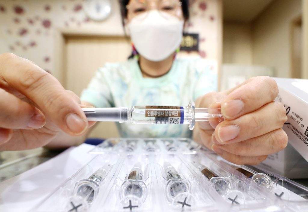 A nurse shows a flu vaccine at a clinic in Seoul, South Korea on Sept. 22, 2020.
