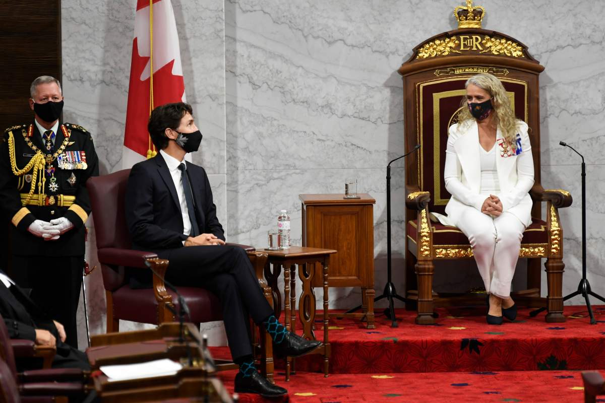 Gov. Gen. Julie Payette and Prime Minister Justin Trudeau wait during the throne speech in the Senate chamber in Ottawa on Wednesday, Sept. 23, 2020. 