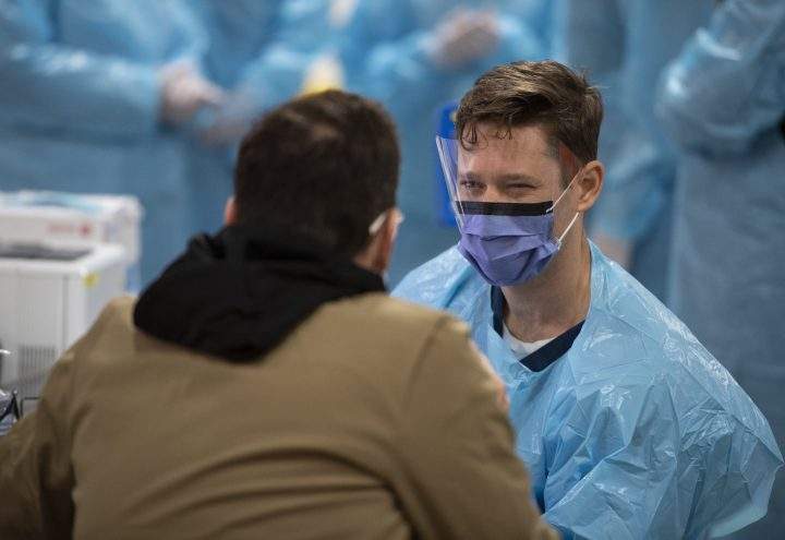 FILE - A person gets assessed at The Brewer Assessment Centre in Ottawa, Ont. 