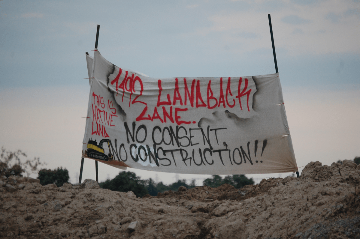 The spokesperson for a group from Six Nations that is occupying a Caledonia construction site is wanted by OPP.