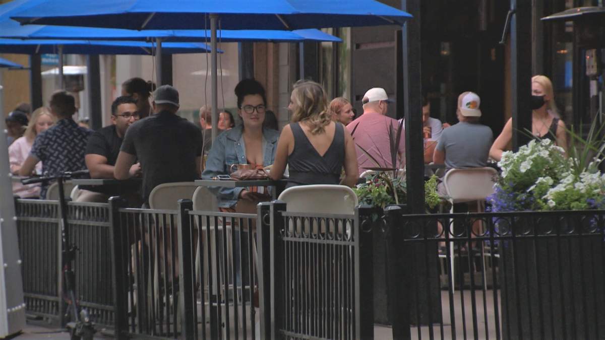 Patrons sit on the patio at Earls Bankers Hall in Calgary located at 315 8 Avenue S.W.