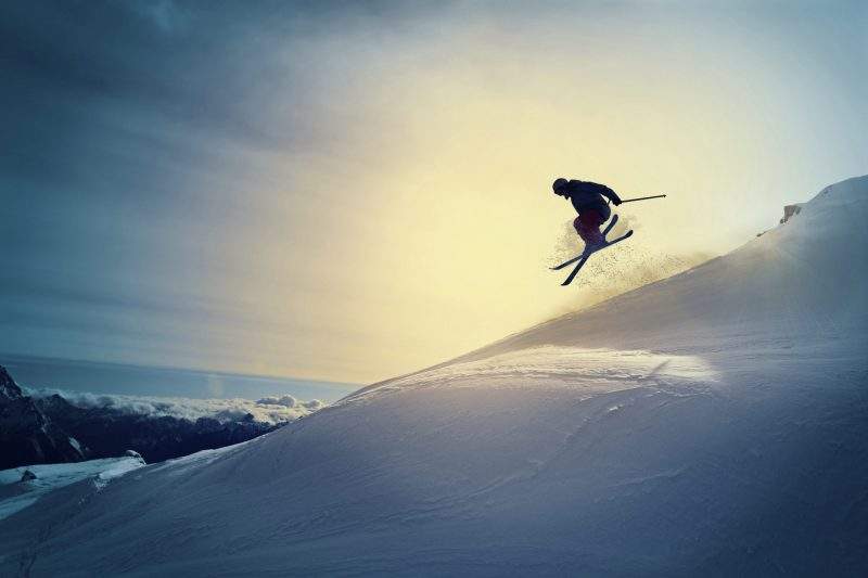 Extreme Freestyle snow skier jumping Off back country skiing