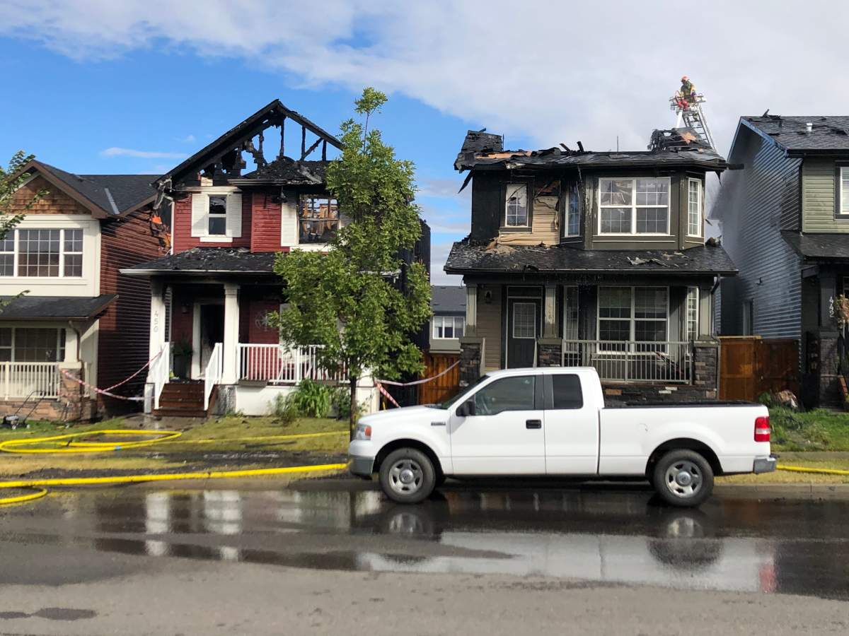 Calgary firefighters battle a house fire in the 400 block of Evanston Drive Northwest on Tuesday, Sept. 8, 2020.