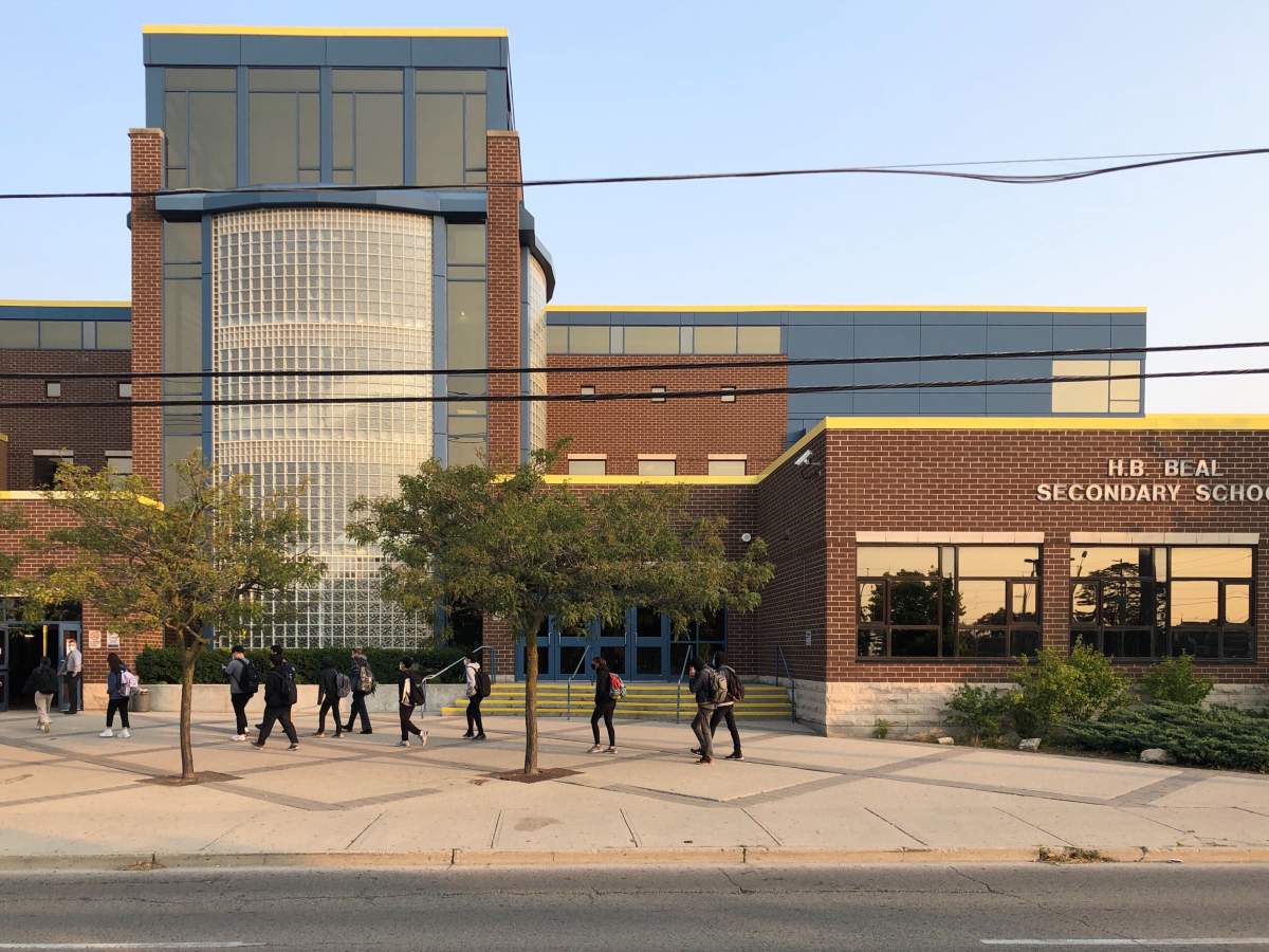 Students file into H.B. Beal Secondary School one day after a case of COVID-19 was reported at the downtown London, Ont. high school.