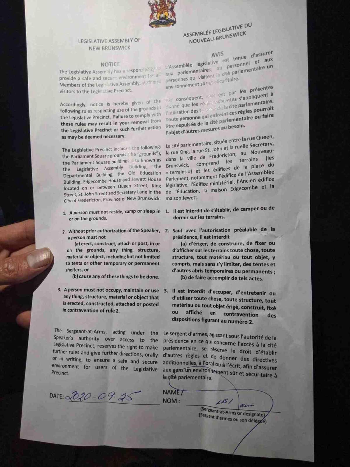 A sergeant-at-arms notice given to attendees of an abortion rights protest and vigil for Clinic 554 in front of the N.B. legislature in Fredericton, after which security removed two tents set up in the protest.