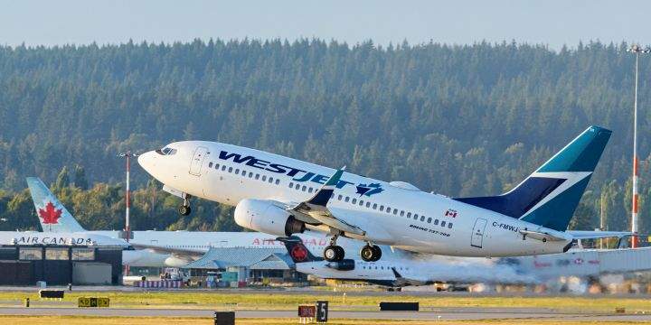 A WestJet Airlines Boeing 737-700 jet (C-FMWJ) takes off from Vancouver International Airport, Richmond, B.C. on Thursday, September 3, 2020. 