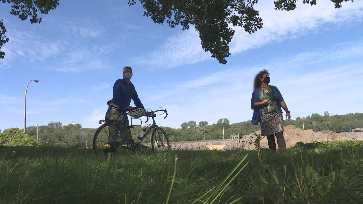 Residents stand near an area near the Turcot interchange where a new park and multipurpose bridge will be built.  (Global News).