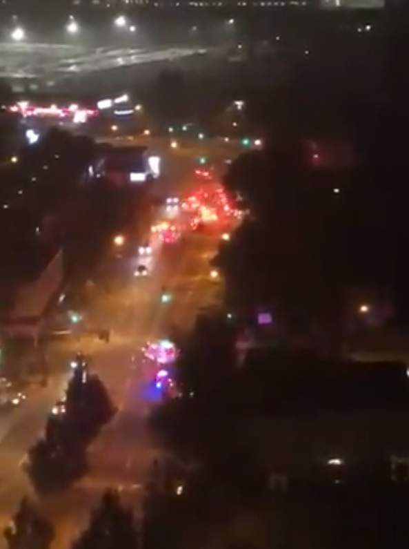 Vancouver fire crews and emergency services converge on Granville Street near West 70th Avenue to deal with a fire in a top floor suite of a residential building Thursday night.