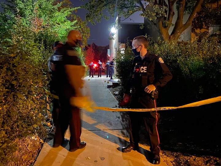 Police putting up yellow tape as they investigate a shooting in the Kipling Avenue and Mt. Olive Drive area in Etobicoke.