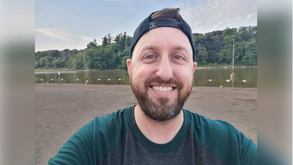 The chair of Hamilton's LGBTQ advisory committee, Cameron Kroetsch, says he will not step down from the post despite the recommendation from the city's integrity commissioner in a report.