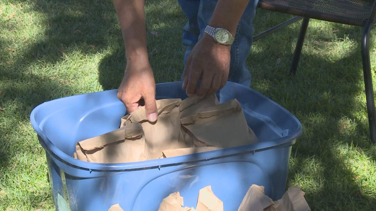 Volunteers handed out free meals at Lethbridge's Galt Gardens on Friday afternoon.
