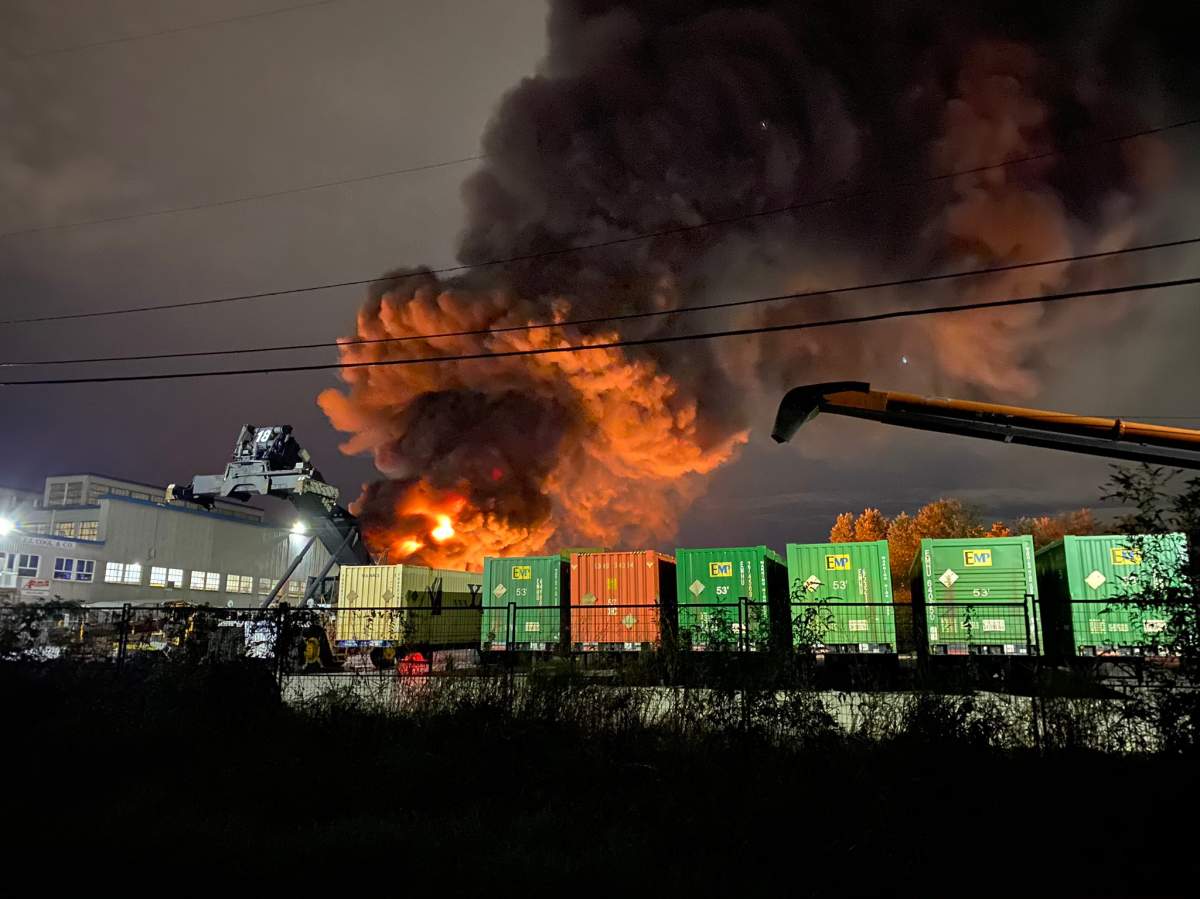 A huge fire burning in an industrial area of New Westminster’s Queensborough neighbourhood Monday evening.