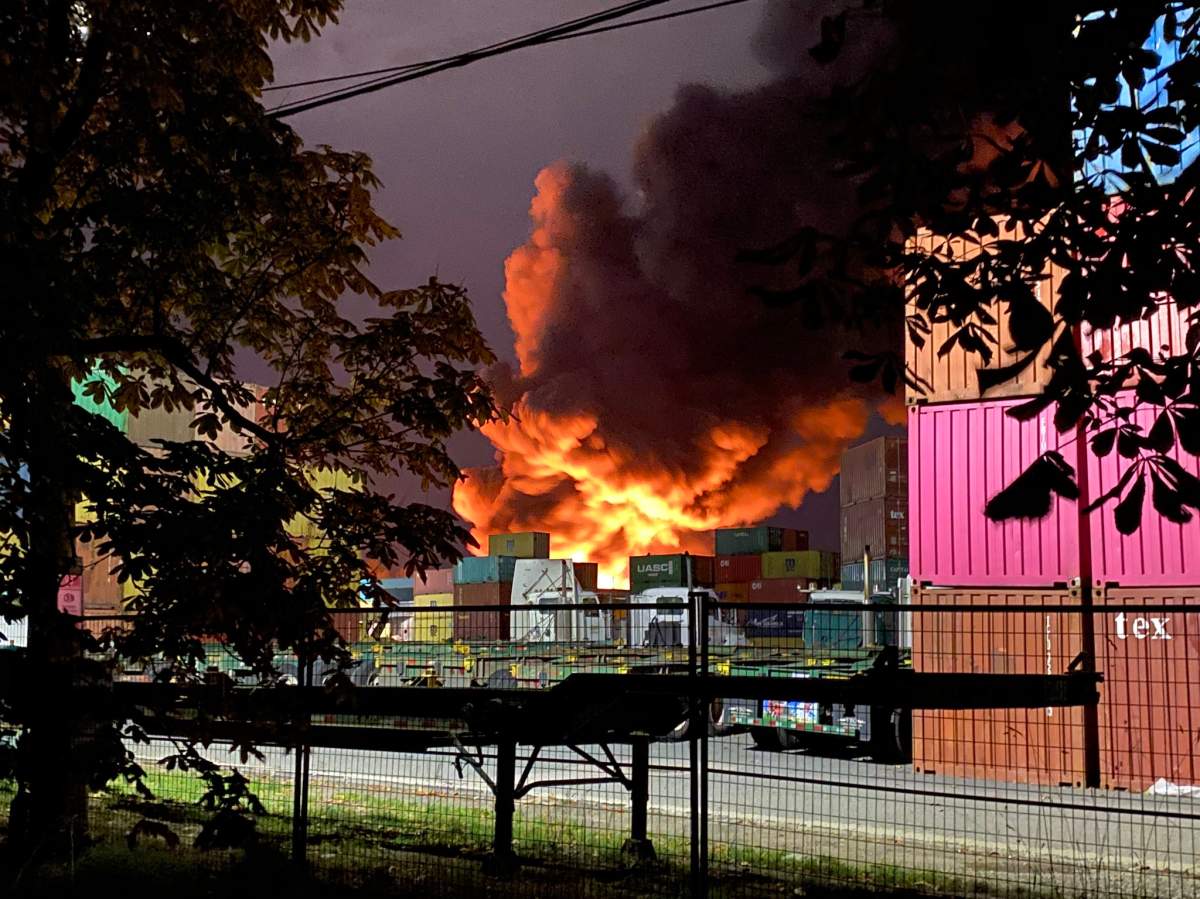 A huge fire burning in an industrial area of New Westminster’s Queensborough neighbourhood Monday evening.