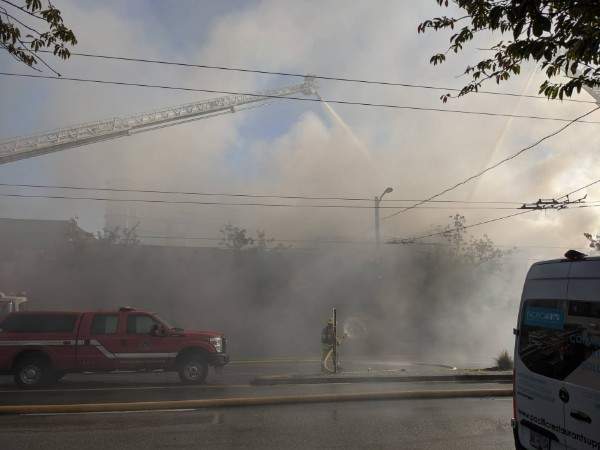 Crews are battling a three-alarm fire in the 2400-block of Main St.