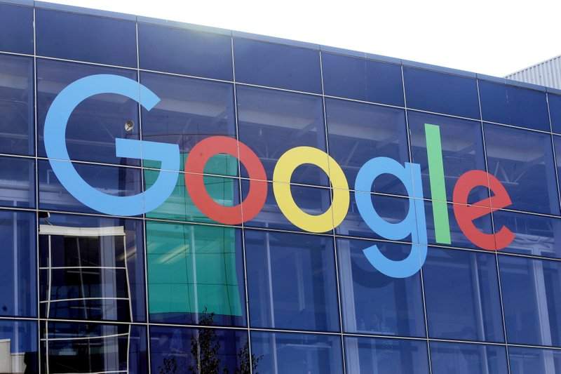 In this Sept. 24, 2019, file photo a sign is shown on a Google building at their campus in Mountain View, Calif.