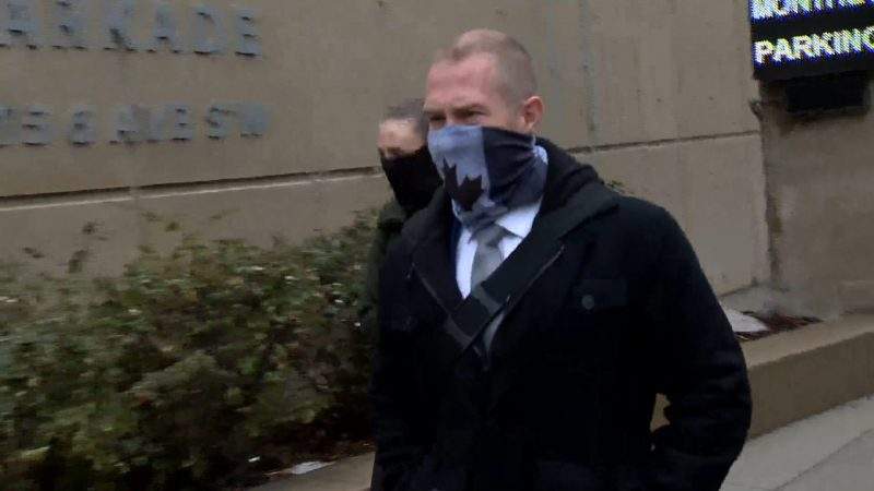 Const. Alex Dunn enters the Calgary Courts Centre on Oct. 28, 2020.