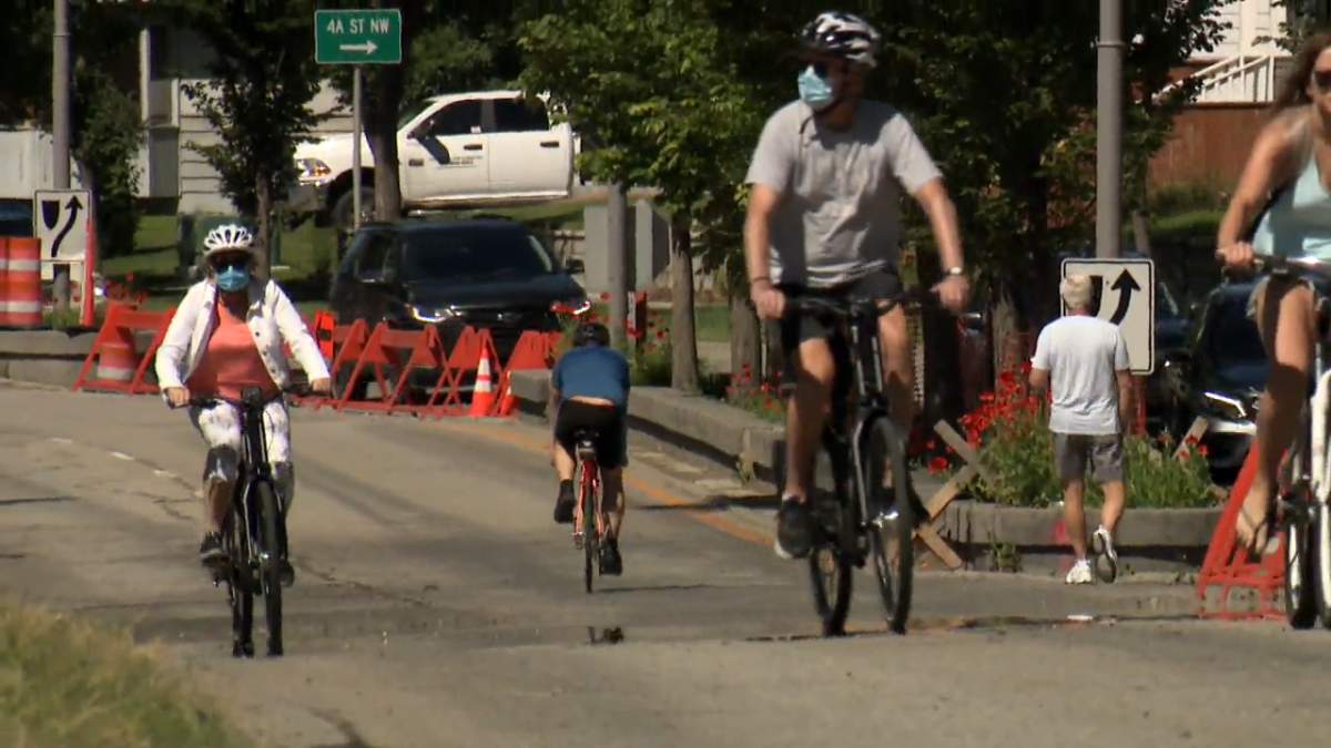 Cyclists ride along one of the many adaptive road closures in Calgary aimed at helping people physically distance while being active during the COVID-19 pandemic. 