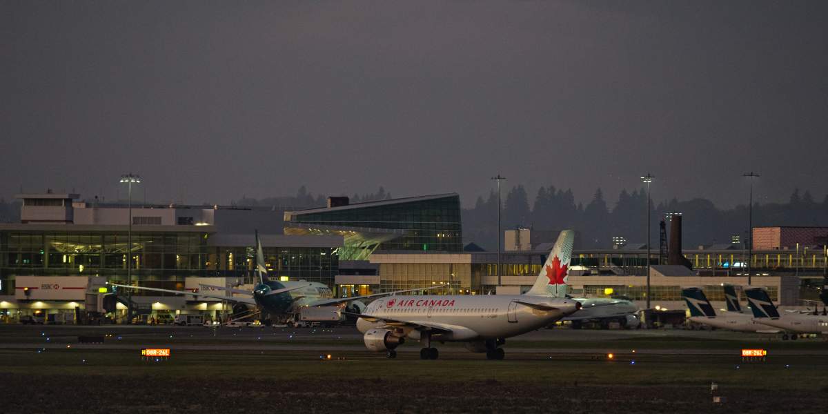 An Air Canada Airbus A319 jet (C-GBIP) waits to taxi across an active runway at Vancouver International Airport, Richmond, B.C. on Monday, October 5, 2020. 