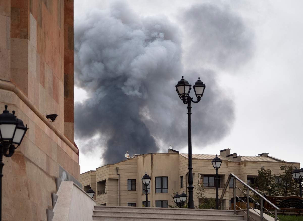 Smoke rises after shelling by Azerbaijan's artillery during a military conflict in Stepanakert, self-proclaimed Republic of Nagorno-Karabakh, Wednesday, Oct. 7, 2020. Armenia accused Azerbaijan of firing missiles into the capital of the separatist territory of Nagorno-Karabakh, while Azerbaijan said several of its towns and its second-largest city were attacked.