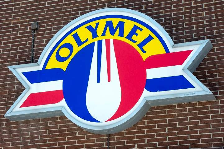 In this March 2020 file photo, an Olymel sign is seen outside a facility in Anjou. So far, 65 workers at an Olymel owned plant in the Beauce region have tested positive for COVID-19. Thursday, Oct. 22, 2020.