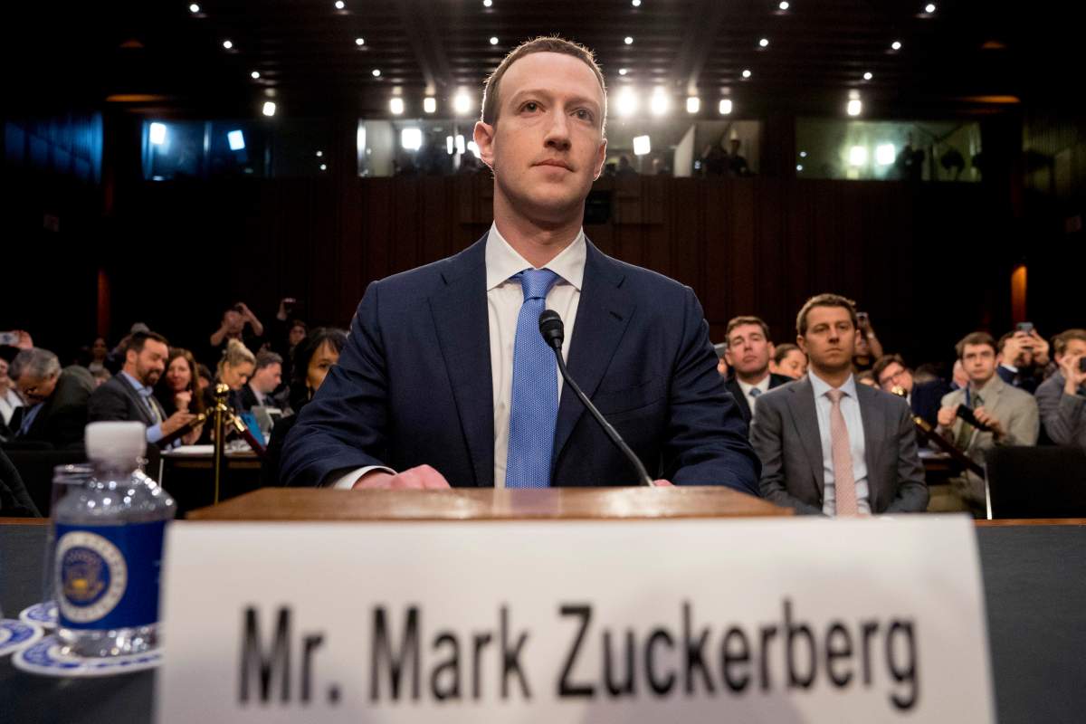 FILE - In this Tuesday, April 10, 2018 file photo, Facebook CEO Mark Zuckerberg arrives to testify before a joint hearing of the Commerce and Judiciary Committees on Capitol Hill in Washington. Holocaust survivors around the world are lending their voices to a campaign launched Wednesday, July 29, 2020, targeting Facebook head Mark Zuckerberg, urging him to take action to remove denial of the Nazi genocide from the social media site. (AP Photo/Andrew Harnik).