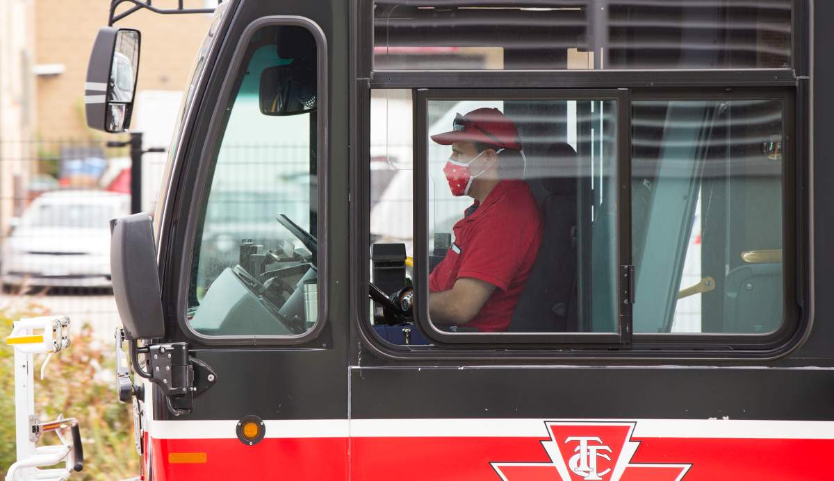 A TTC bus driver wearing a face mask is seen on a bus in Toronto on Sept. 17, 2020.